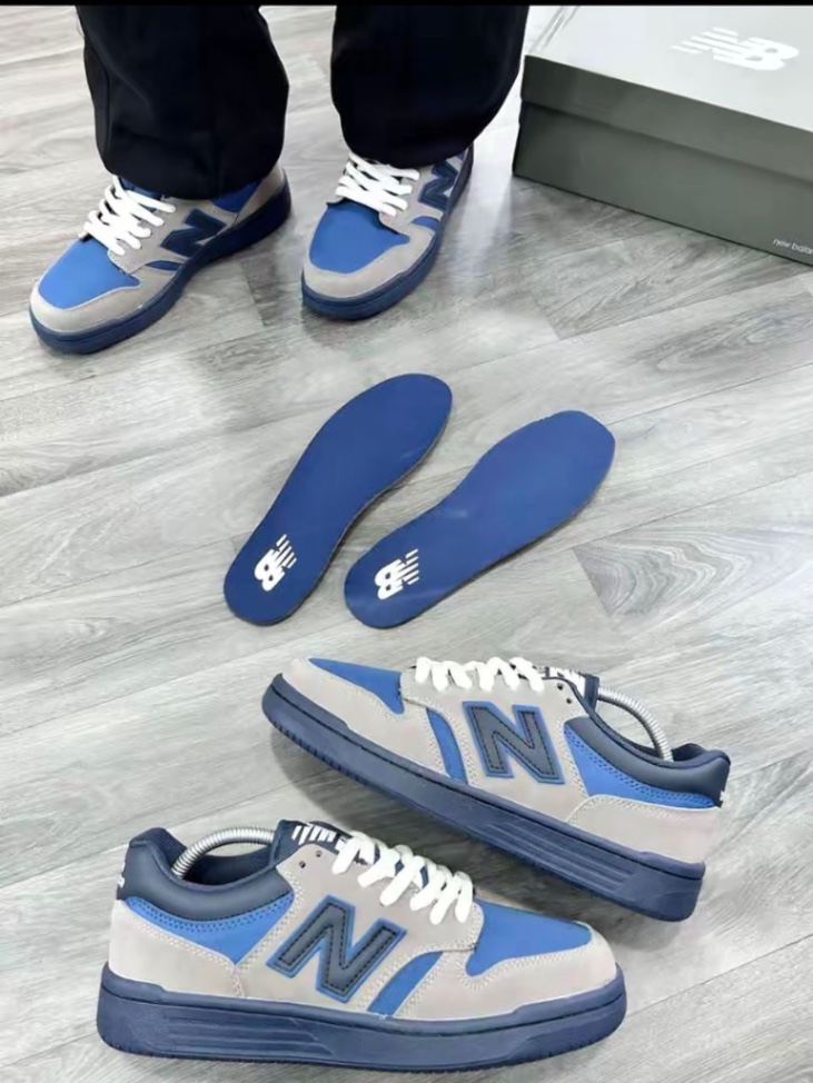 New Balance 480 unisex sneakers in a blue and grey colorway.