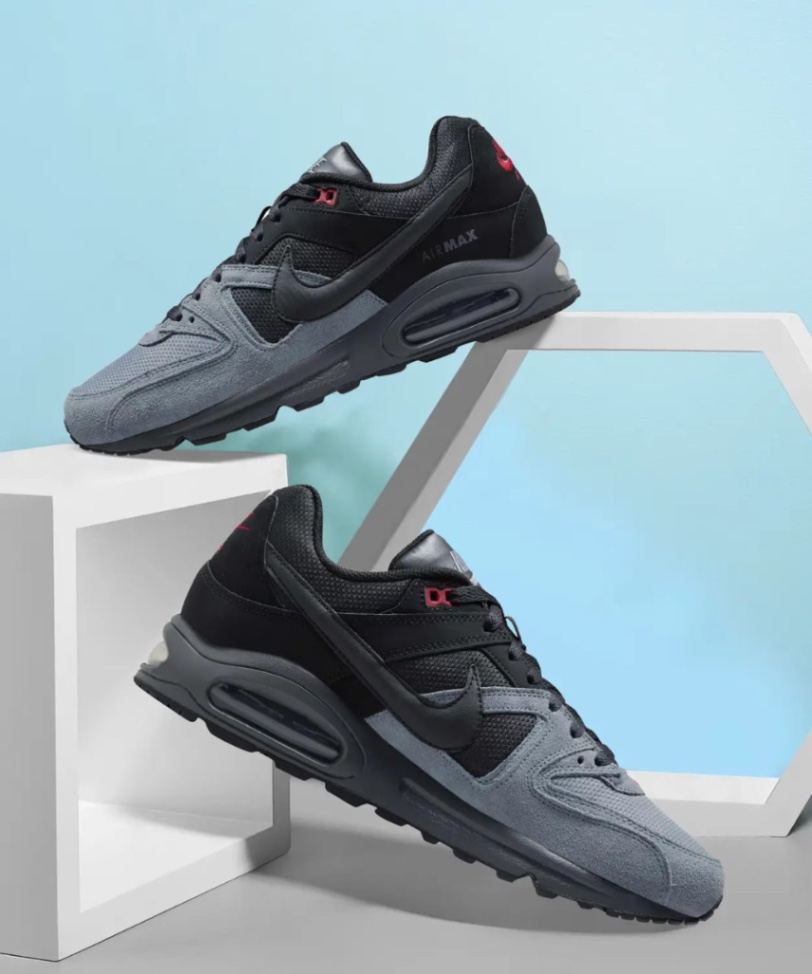 Nike Air Max Command sneakers in a black and dark grey colorway with red accents