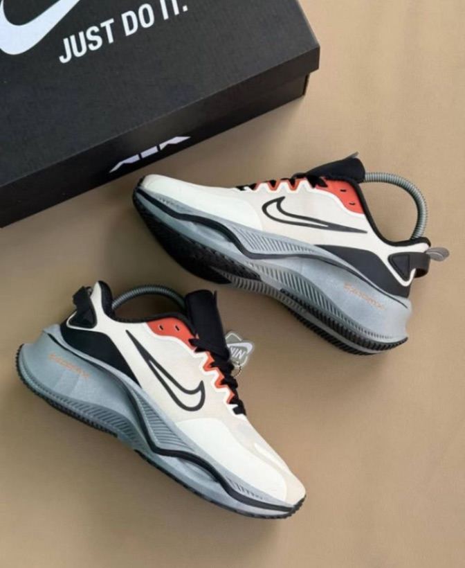 Nike Smiley Zoom Sneakers featuring a white, black, and red color scheme. 