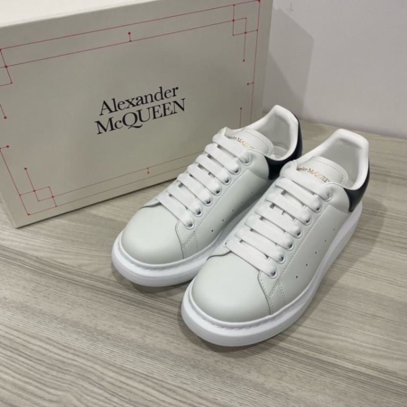 Alexander McQueen Oversized Sneakers in white leather with a black heel tab