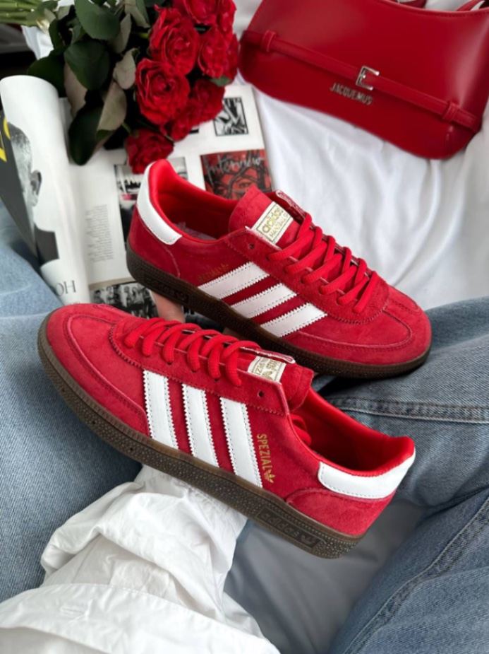 Adidas Handball Spezial sneakers in the vibrant "Scarlet" red colorway, featuring a premium suede upper.